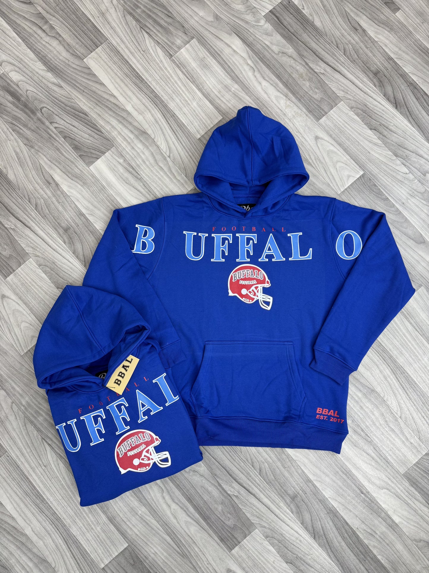 Close-up of a Buffalo Cross Script Vintage Heavyweight Hoodie, showing the cross script design.