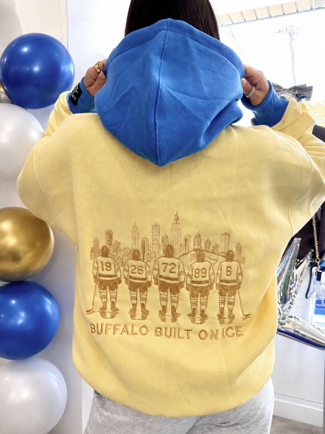 Buffalo Hockey Town embroidered hoodie with vintage design in yellow and blue, cozy oversized fit