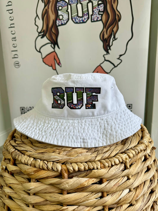 A "View From The Ralph" Bucket Hat - White 100% cotton bucket hat with a classic fit, available in sizes M and L, perfect for casual and game-day style.
