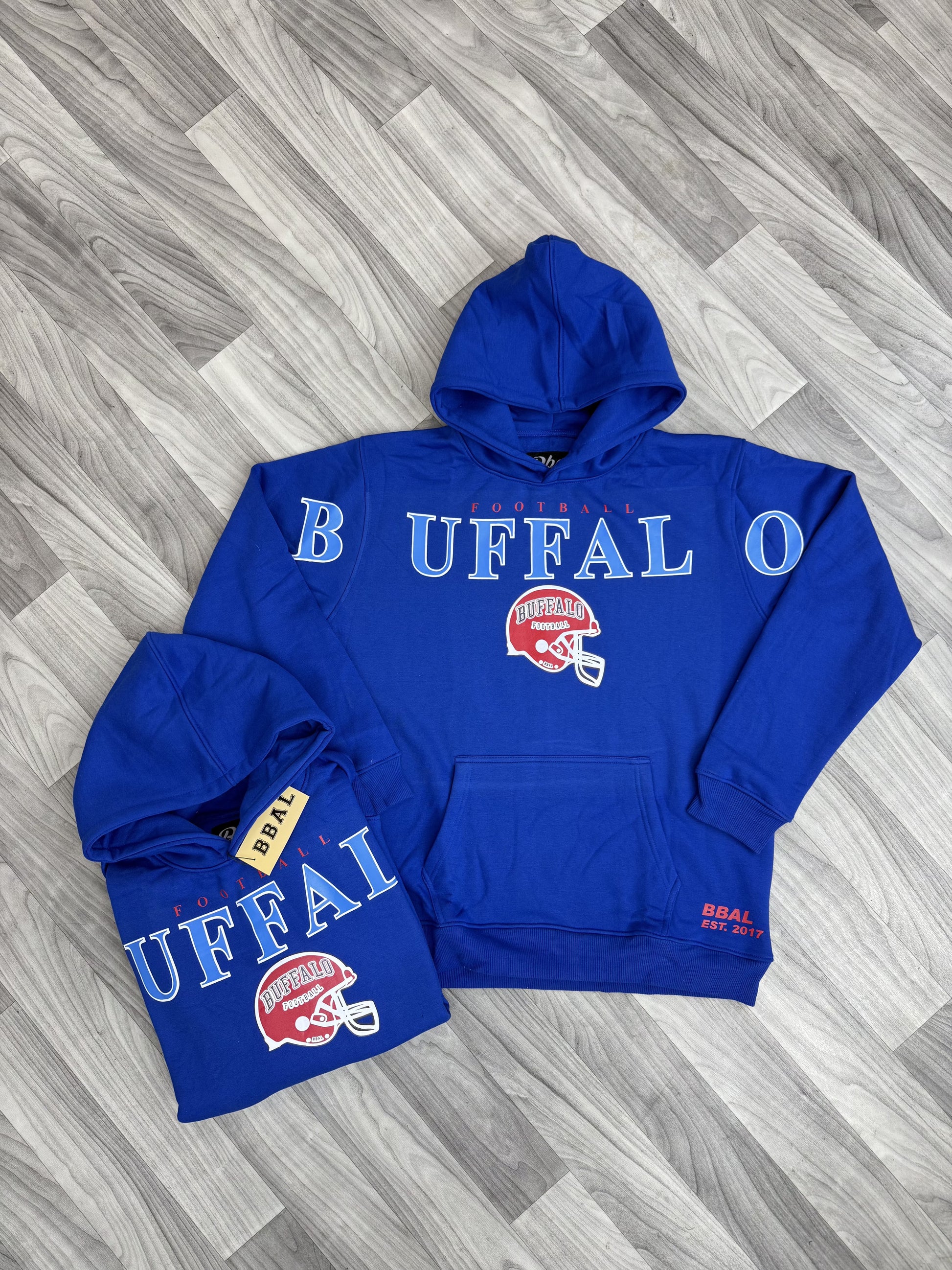 Close-up of a Buffalo Cross Script Vintage Heavyweight Hoodie, showing the cross script design.
