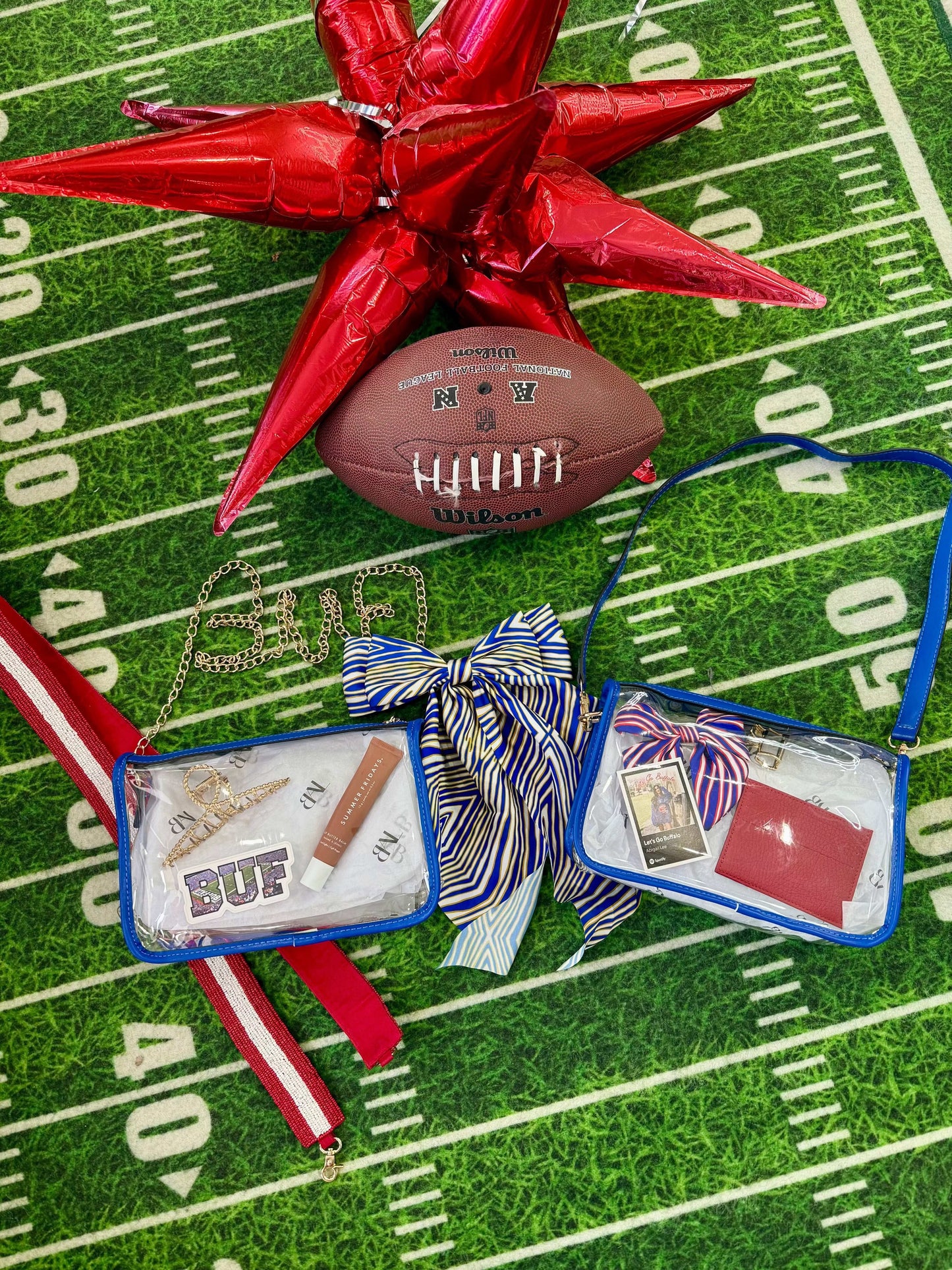 Clear blue Buffalo Bills stadium bag with beaded red strap and interchangeable straps