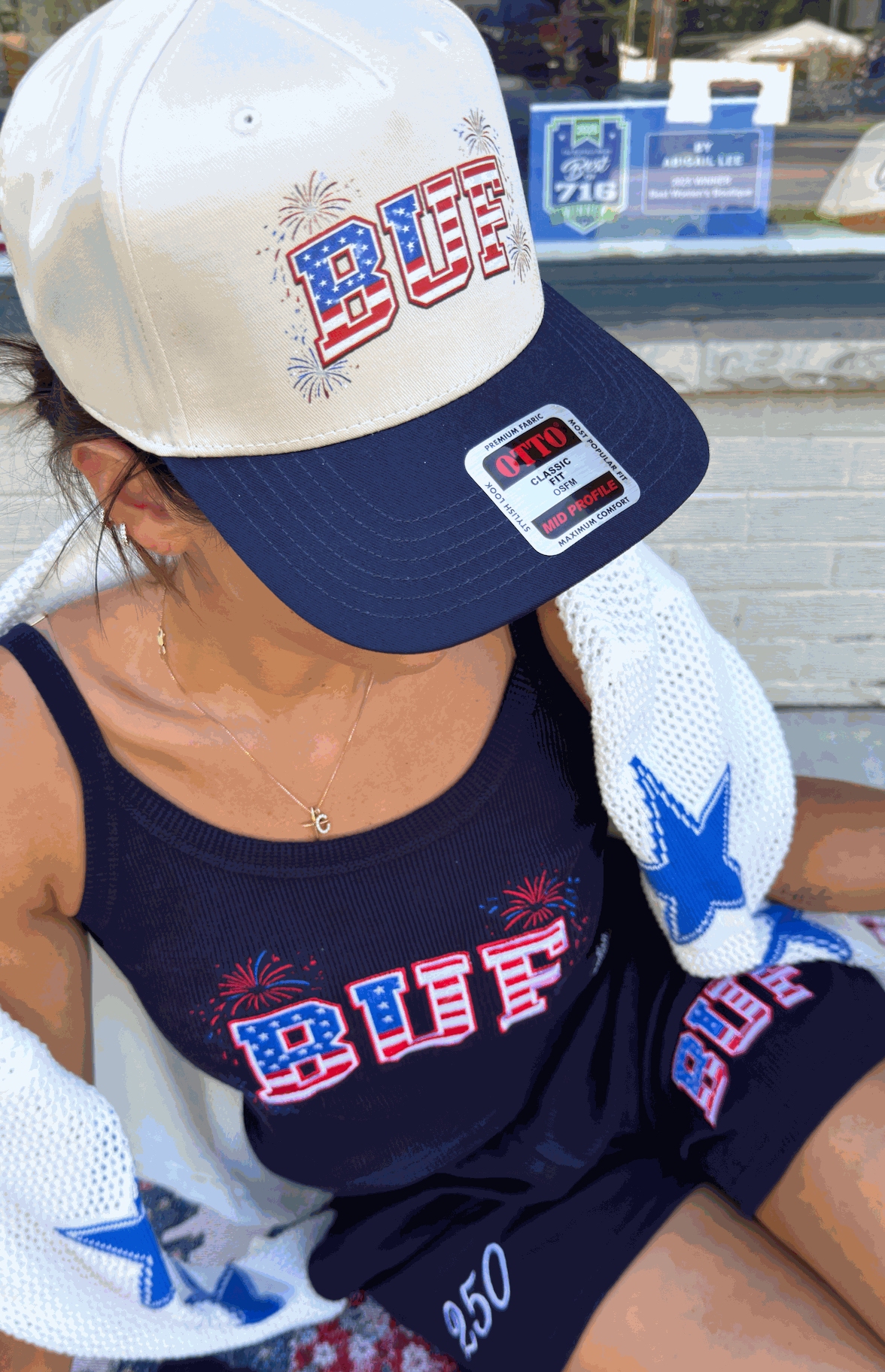 Celebrating 250 BUF Hat with dual cream and navy design, adjustable fit, and BUF firework flag detail.