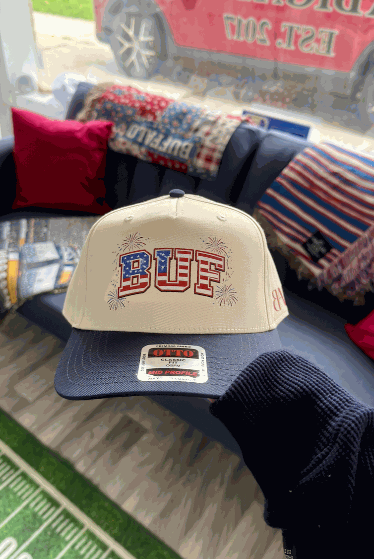 Celebrating 250 BUF Hat with dual cream and navy design, adjustable fit, and BUF firework flag detail